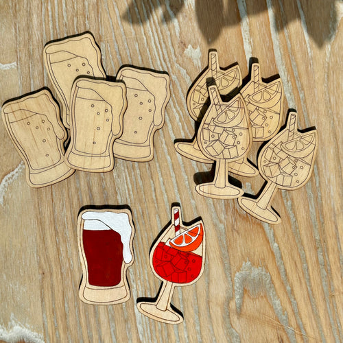 Beer vs Aperol tic-tac-toe pieces with painted examples